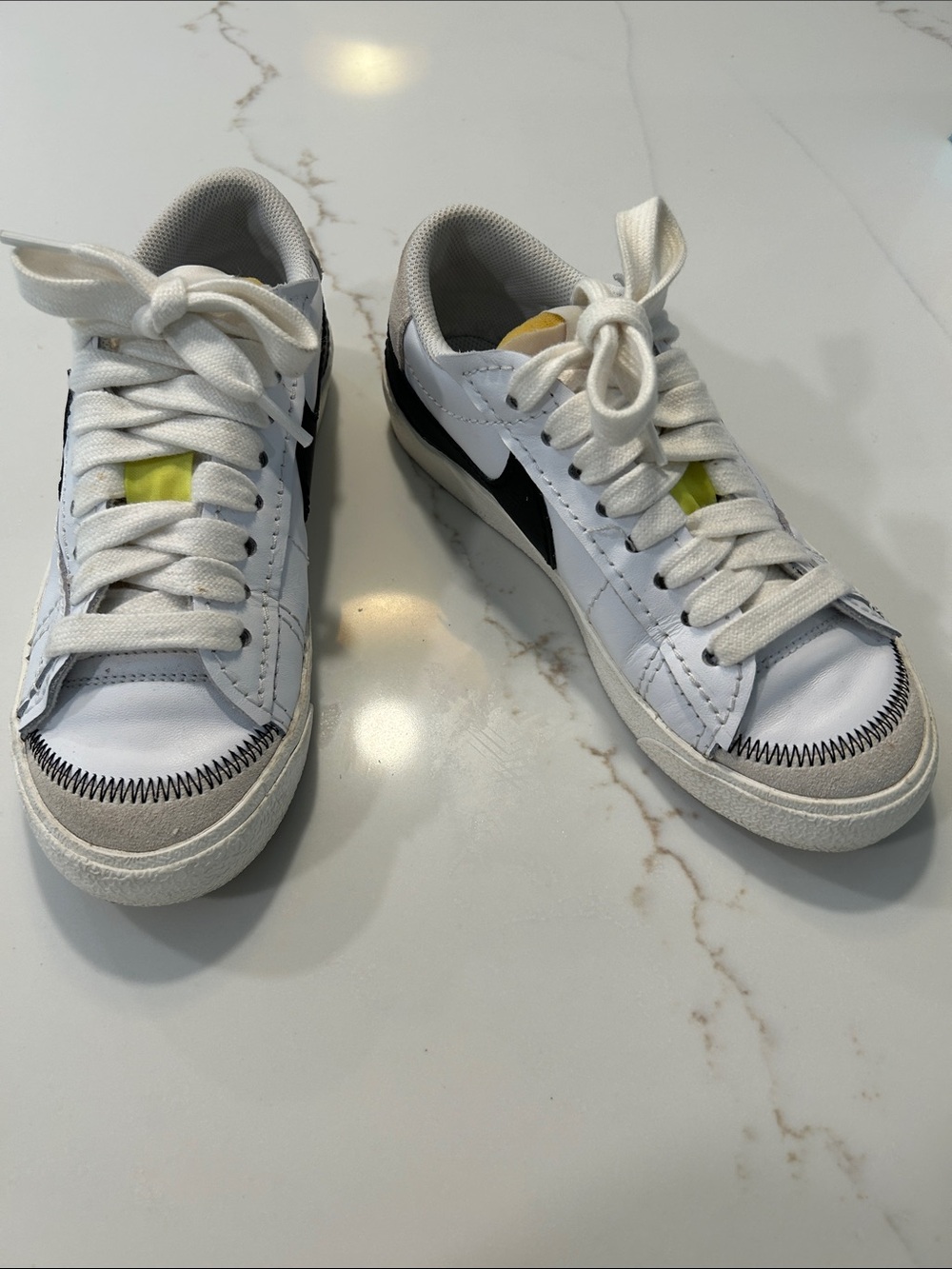 Nike Women’s Blazer White Sneakers with Black Swoosh and Yellow Tongue Accent